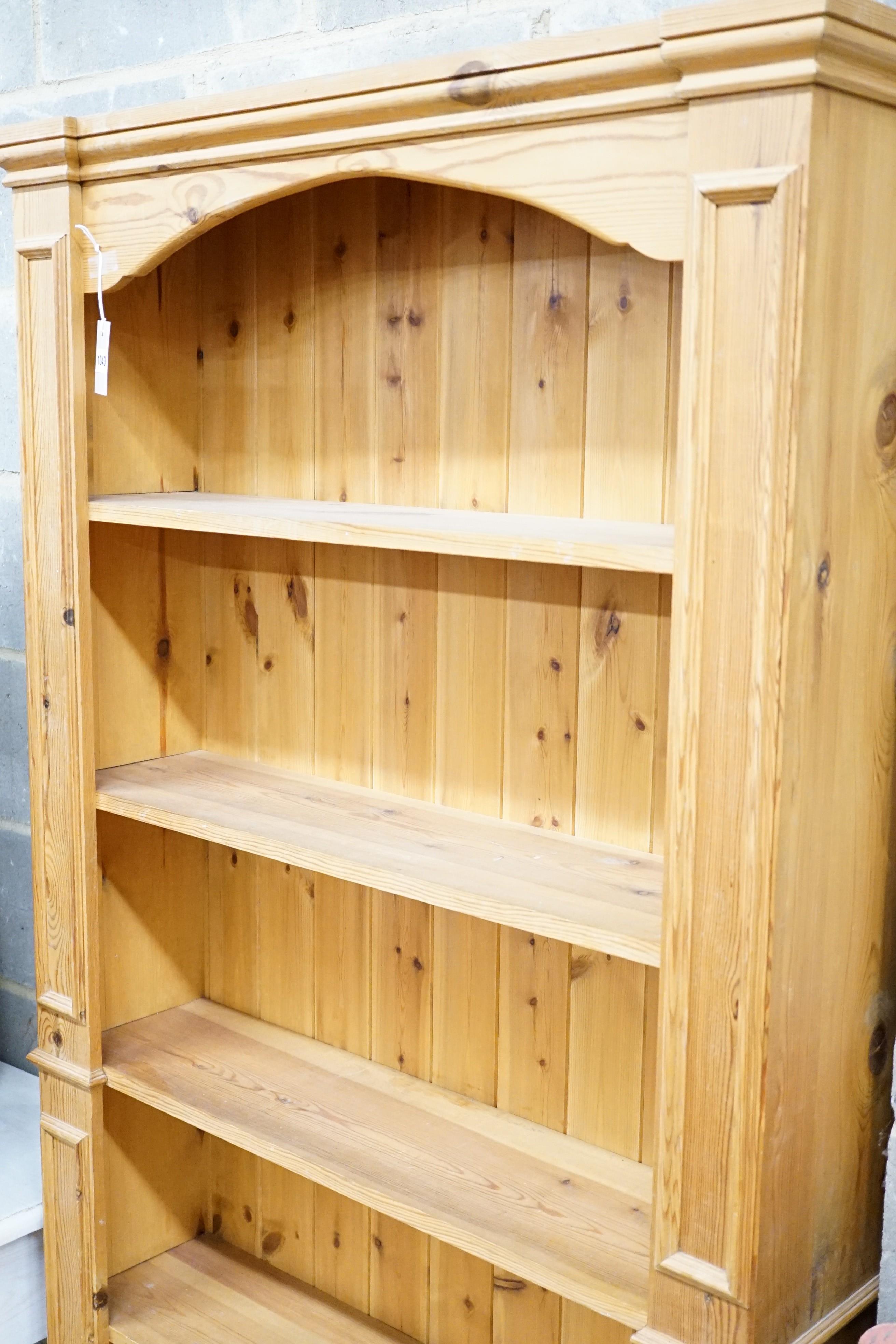 A modern tall pine bookcase, length 94cm, depth 24cm, height 196cm